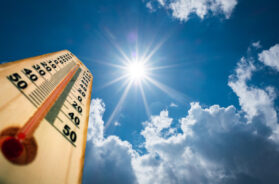 Thermometer Sun high Degres. Hot summer day. High Summer temperatures
